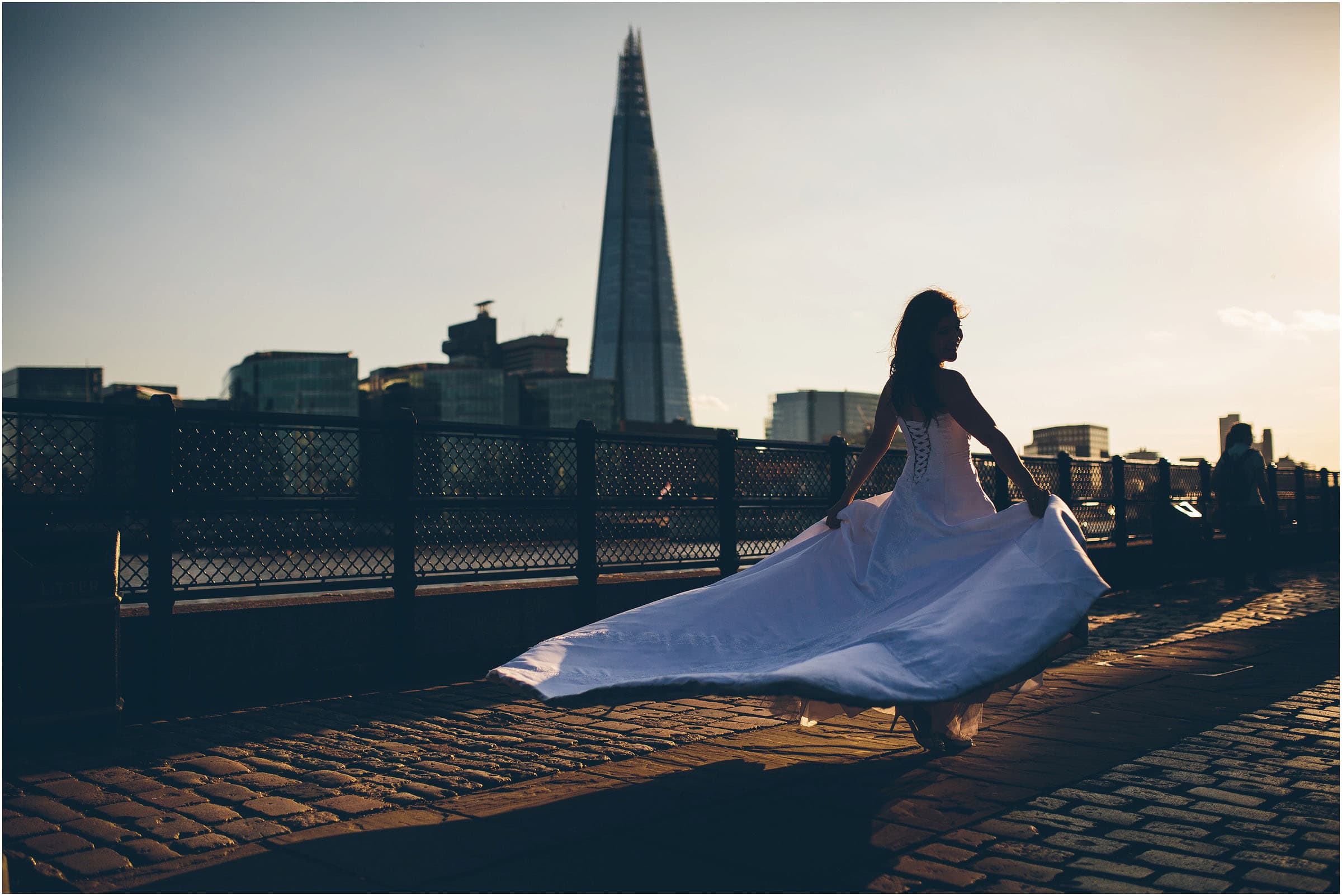 a bride twirling by the river thames in london