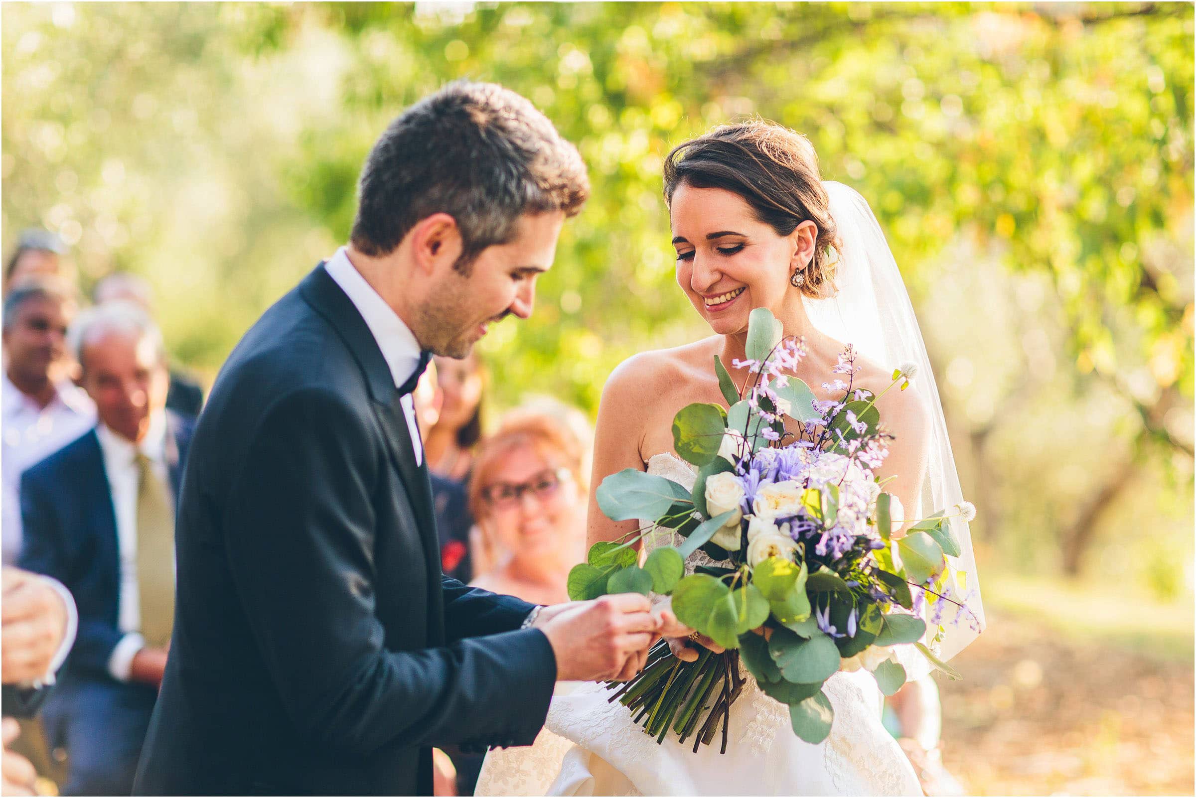 The bride has a beautiful bouquet of flowers at Castello di Vicarello in Tuscany
