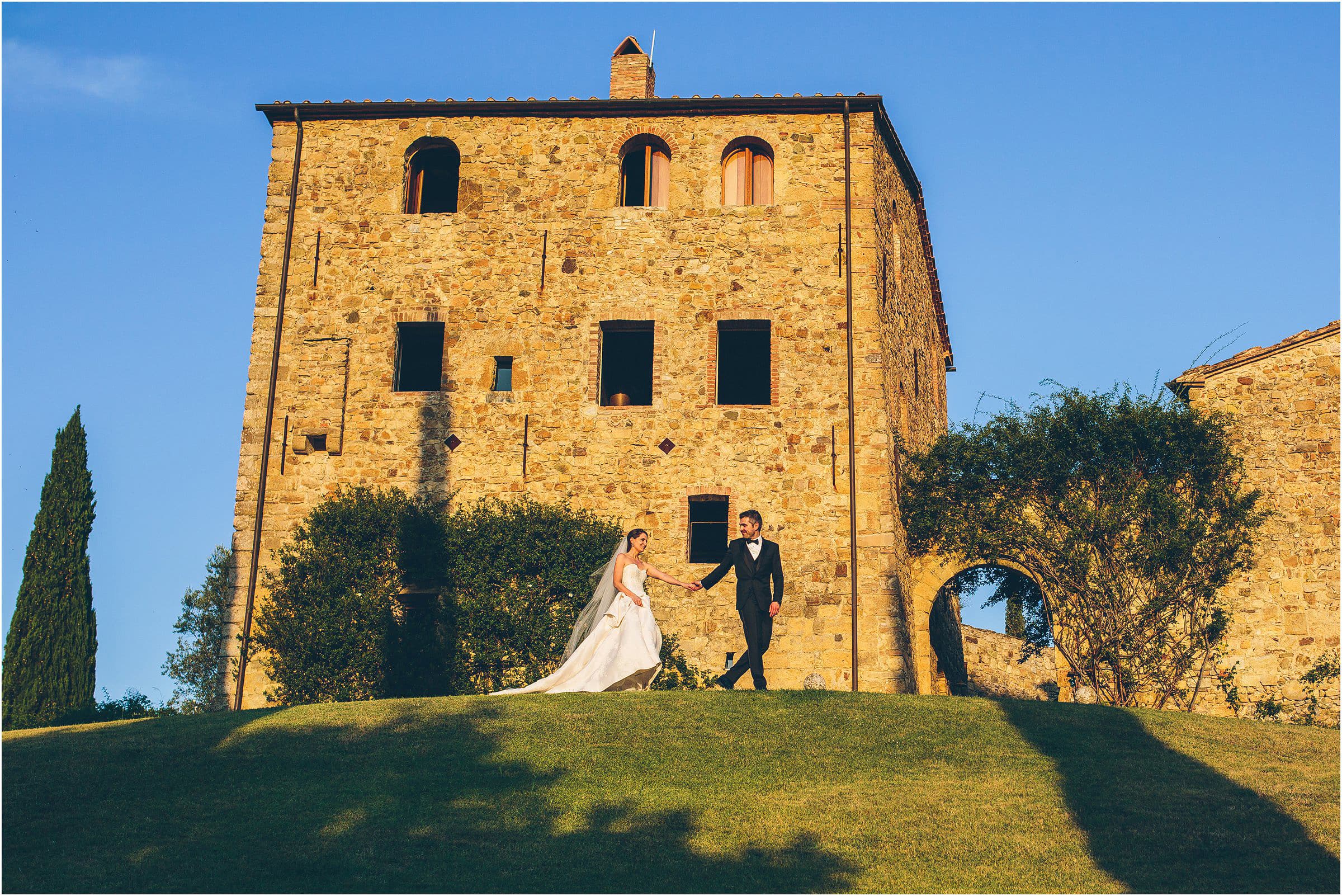 The bride and groom outside Castello di Vicarello in Tuscany