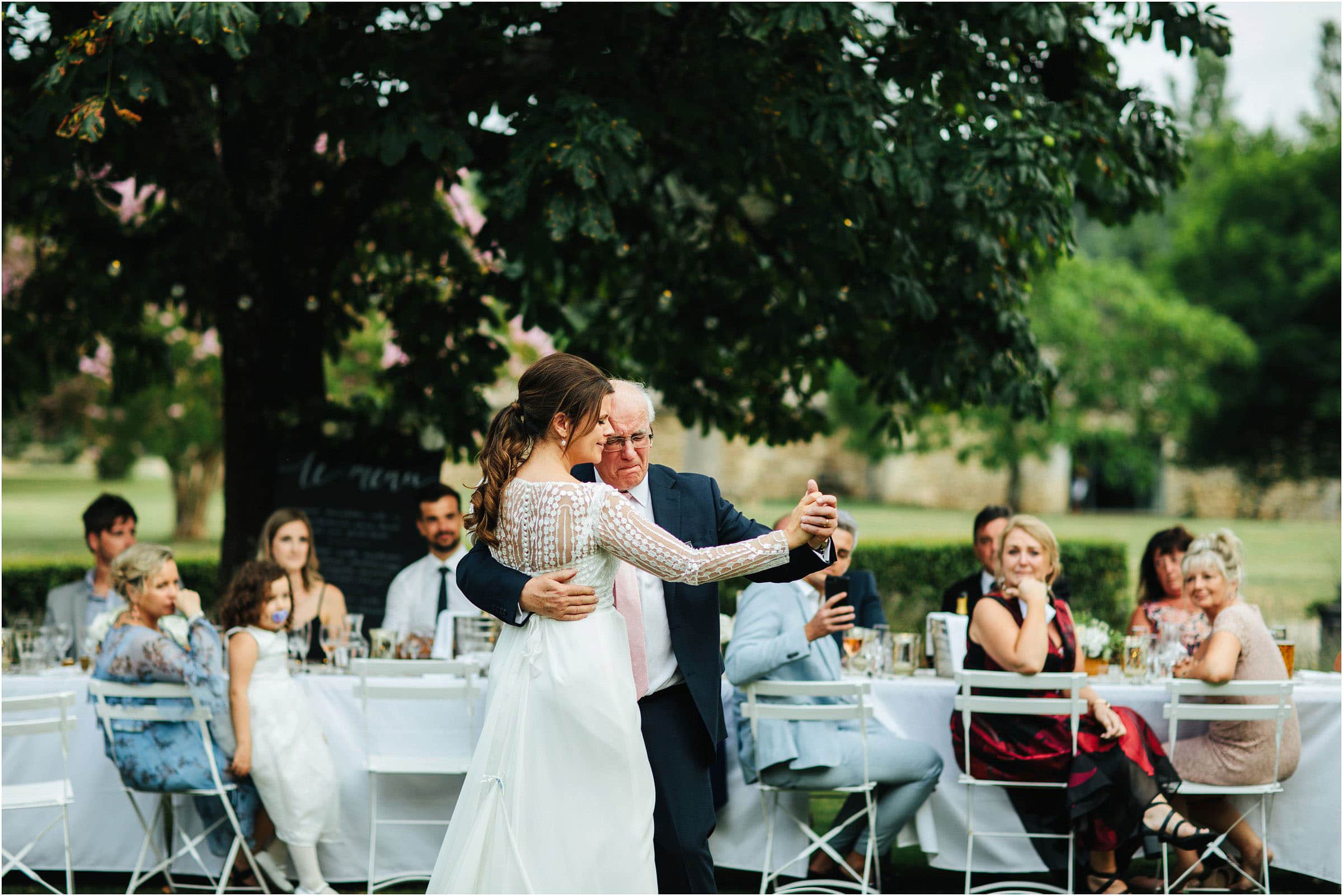 bride and father of the bride dancing outside in the gardens of chateau rigaud